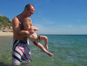 gay dad at beach dollar photo paternal instinct
