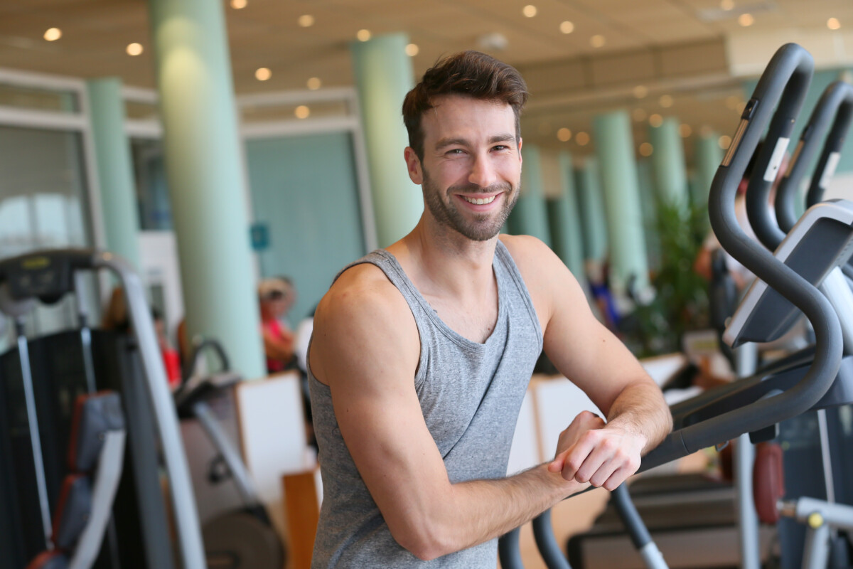 gym crush man at gym gray tank top June 2021 deposit photo